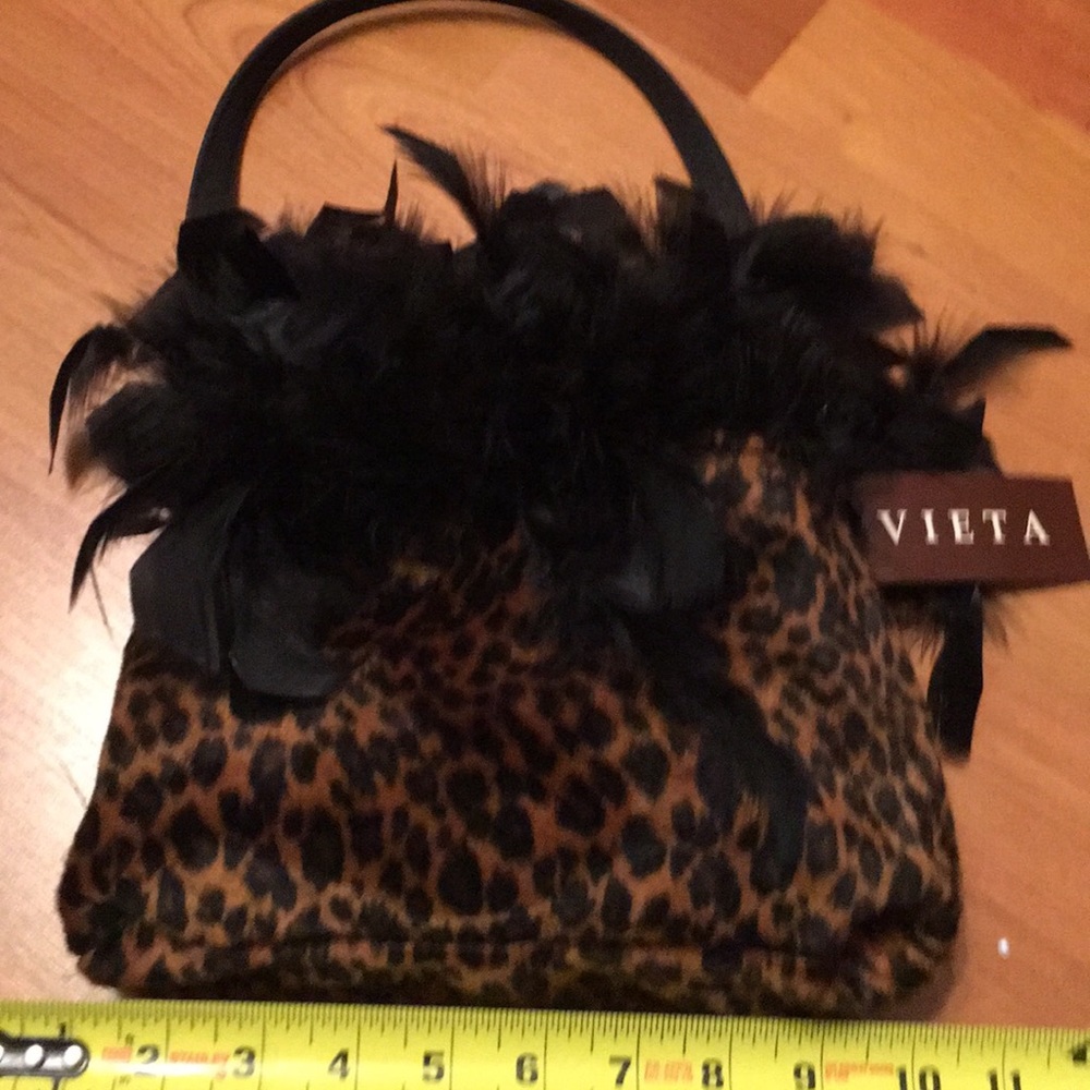 Reverse fun feathered bag new